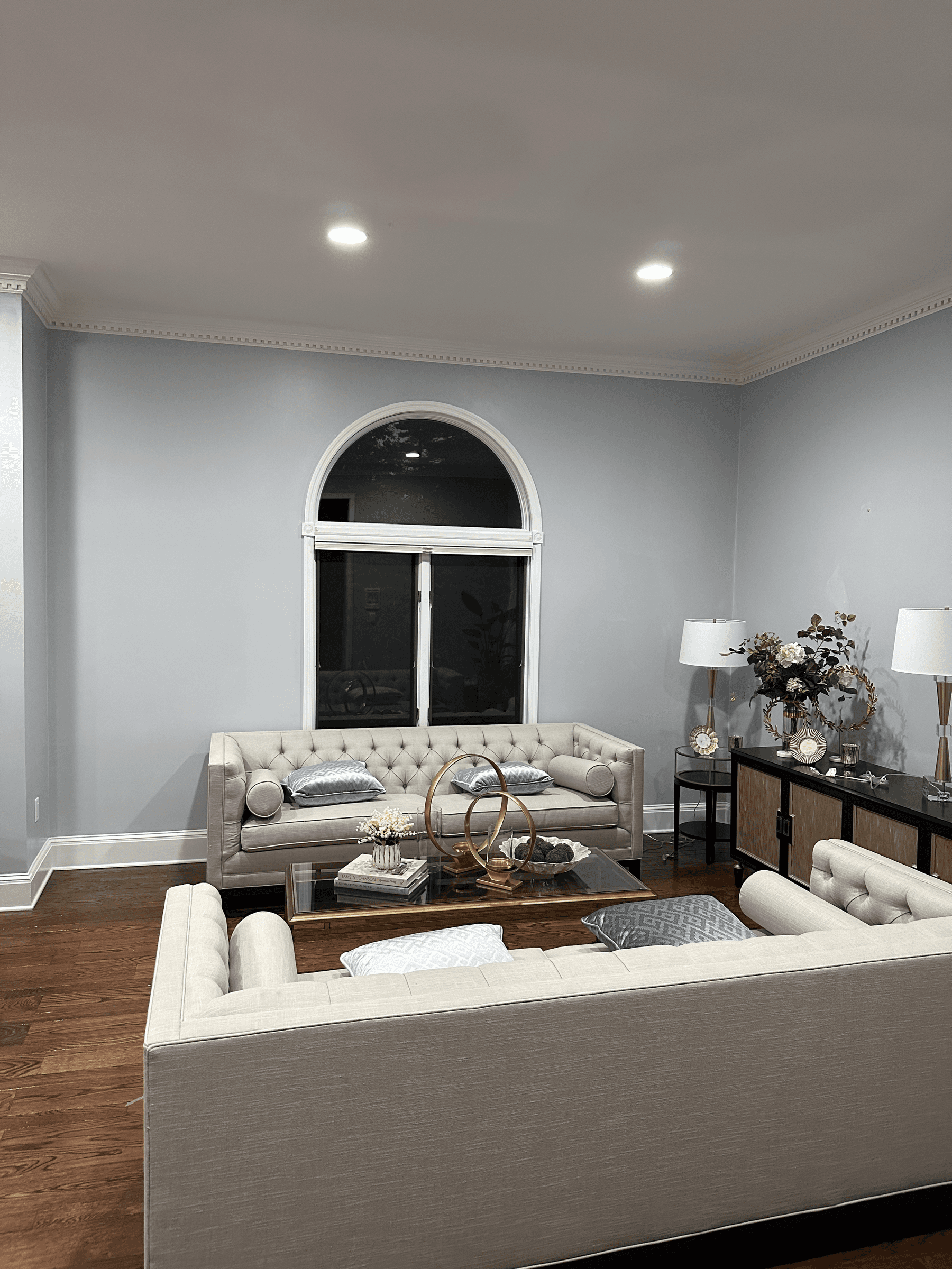 Living room with light gray walls and crown molding
