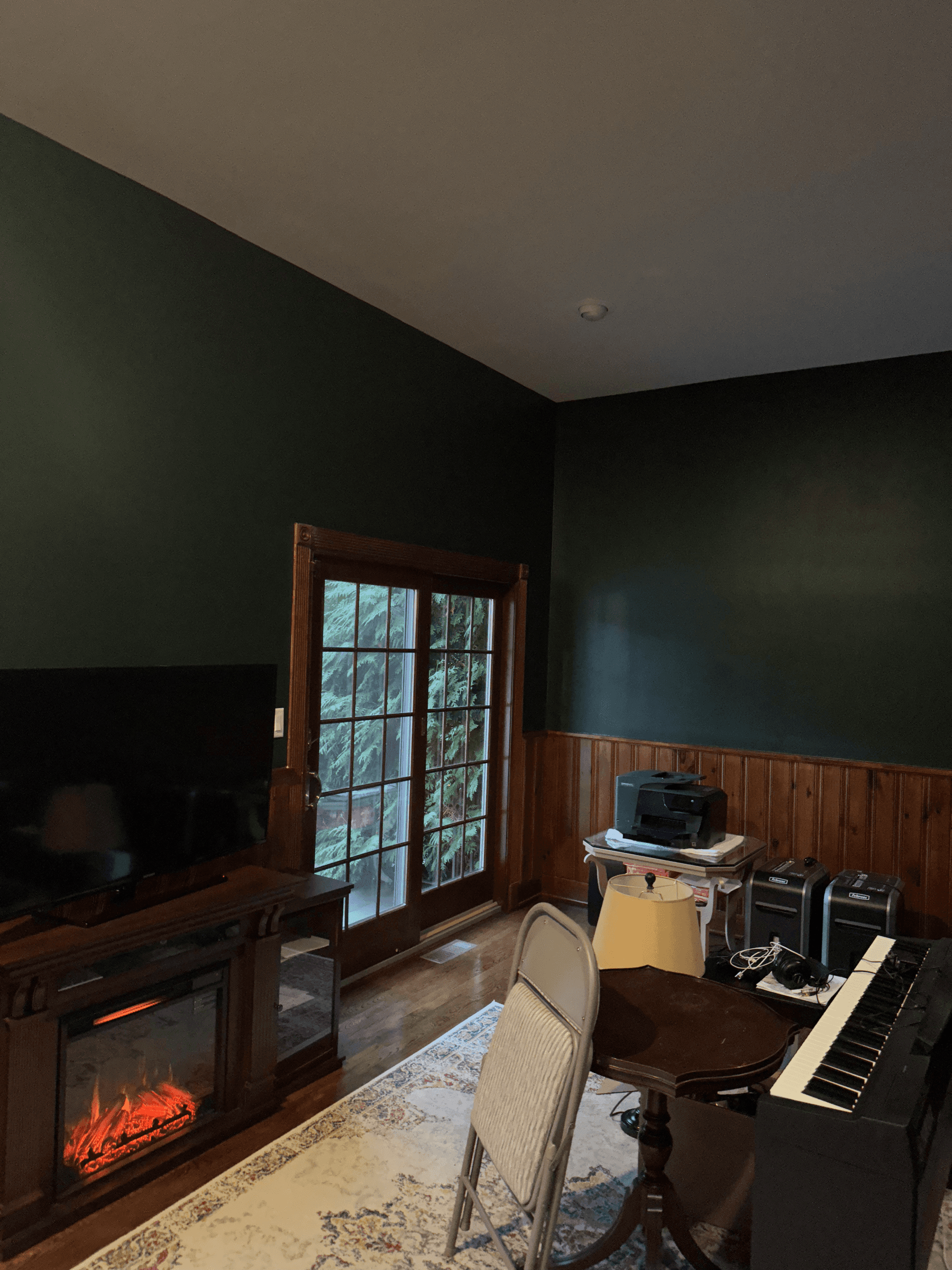The same corner with dark green walls, after painting