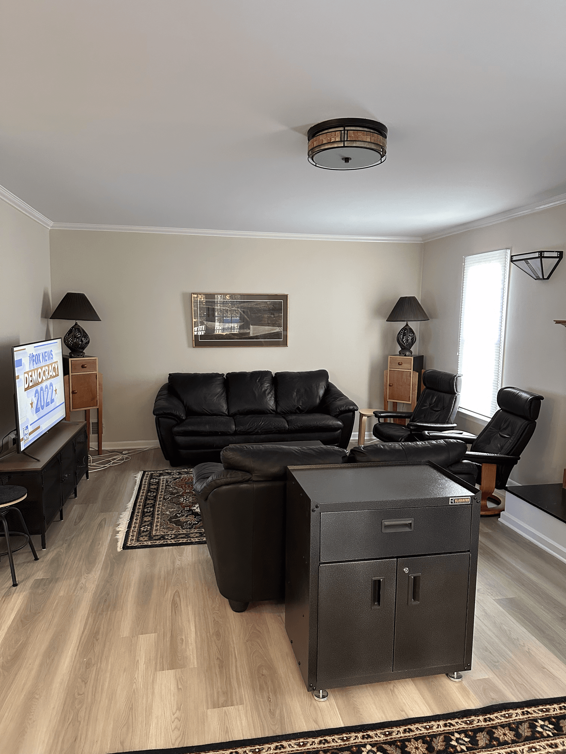 Living room with light neutral walls and crown molding
