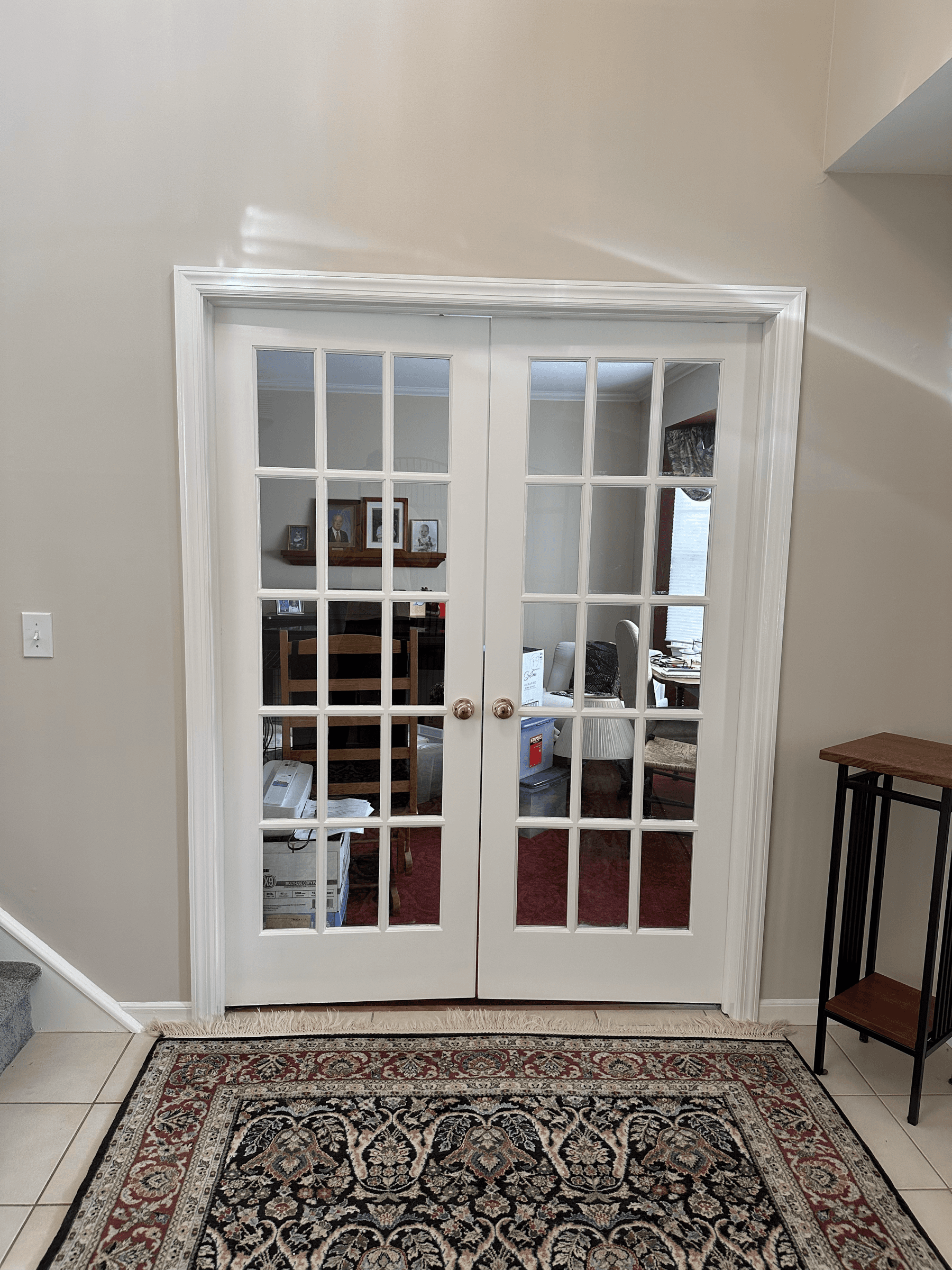 White French doors and trim in an entry hall